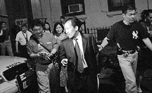 Mr. Guan Jun Liang, a Pro-Communist leader and chairman of the Unified Organization of Overseas Chinese Associations, was arrested by New York City police for his leading role in a group assault against Falun Gong practitioners near a local restaurant. (news)