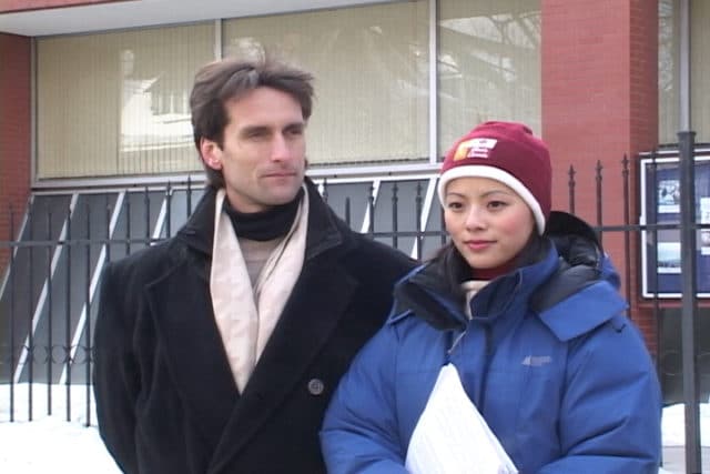 Joel and Cecilia stand outside the Chinese embassy in Toronto, Canada