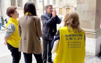 Mauro Poggia, president of the Council of State of Geneva shows his respect to Falun Dafa practitioners on April 28, 2023 in Geneva’s Old Town, Switzerland.