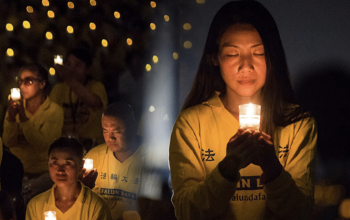 Falun Gong practitioners at the annual candlelight vigil in Washington, D.C. on the anniversary of the persecution in 2017 honoring fellow believers in China who have died during the persecution.