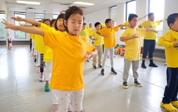 Participants at the 2022 Minghui Summer Camp in Toronto do daily group exercises. (Source: Minghui)