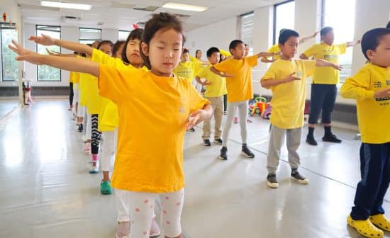 Participants at the 2022 Minghui Summer Camp in Toronto do daily group exercises. (Source: Minghui)